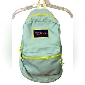 Vintage JanSport Backpack Aqua Blue with Neon Yellow Accents.